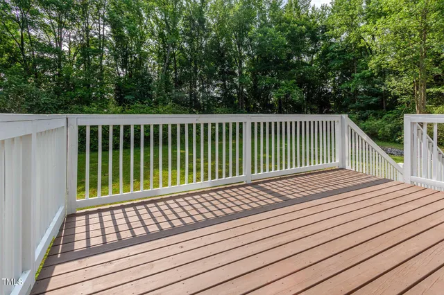 a balcony with view of a wooden floor