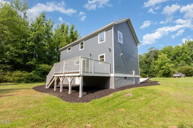 a front view of a house with a yard table and chairs