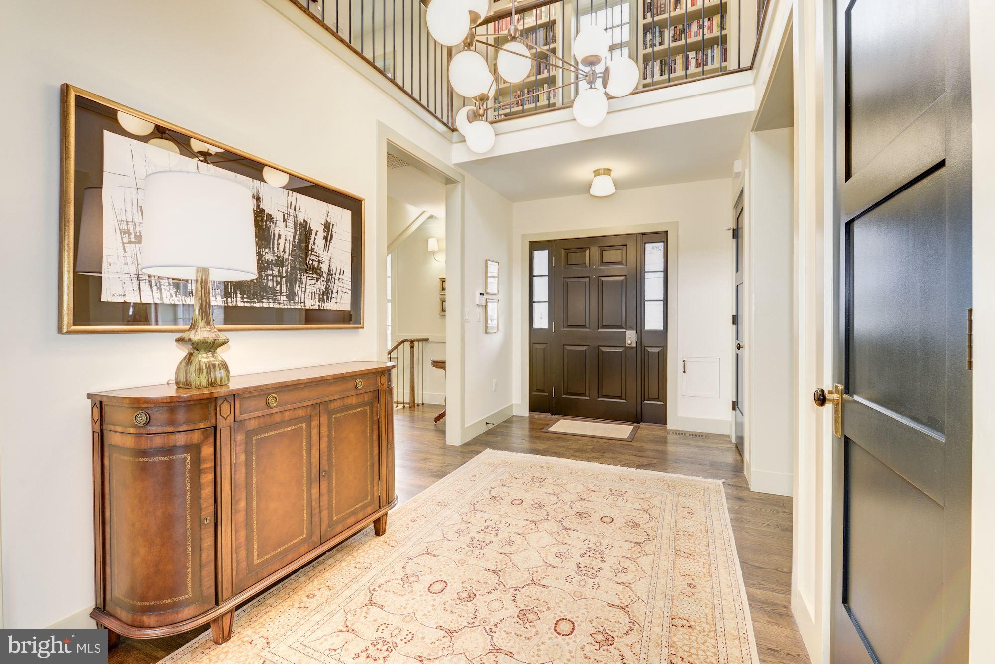6134 Nevada Avenue Chevy Chase, MD 20815 - Photo 3 of 30 a bathroom with a sink a mirror and a shower