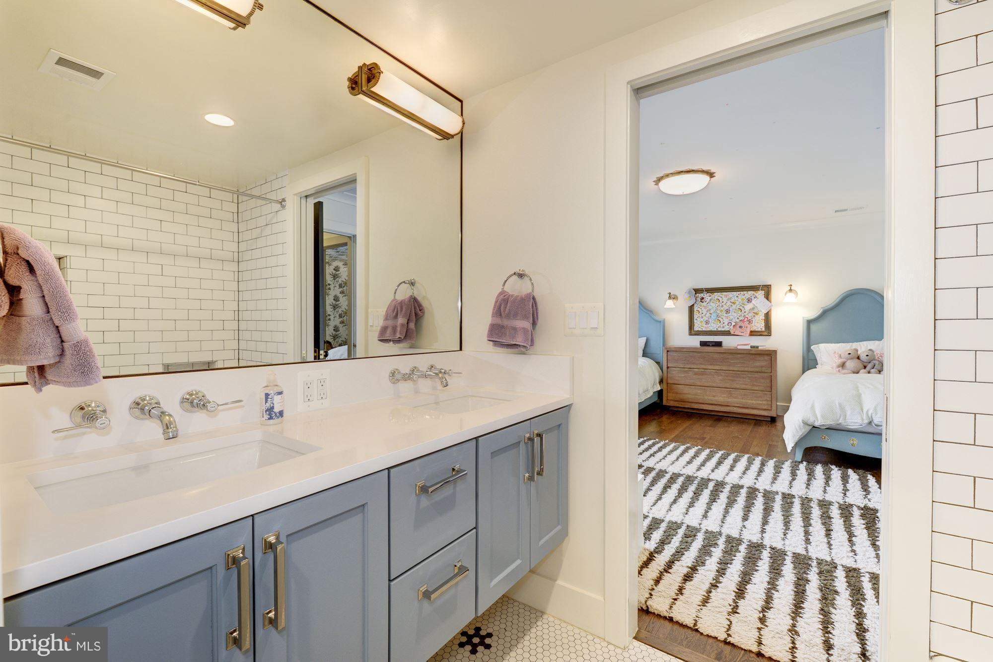 6134 Nevada Avenue Chevy Chase, MD 20815 - Photo 21 of 30 a en suite bathroom with a sink and a mirror