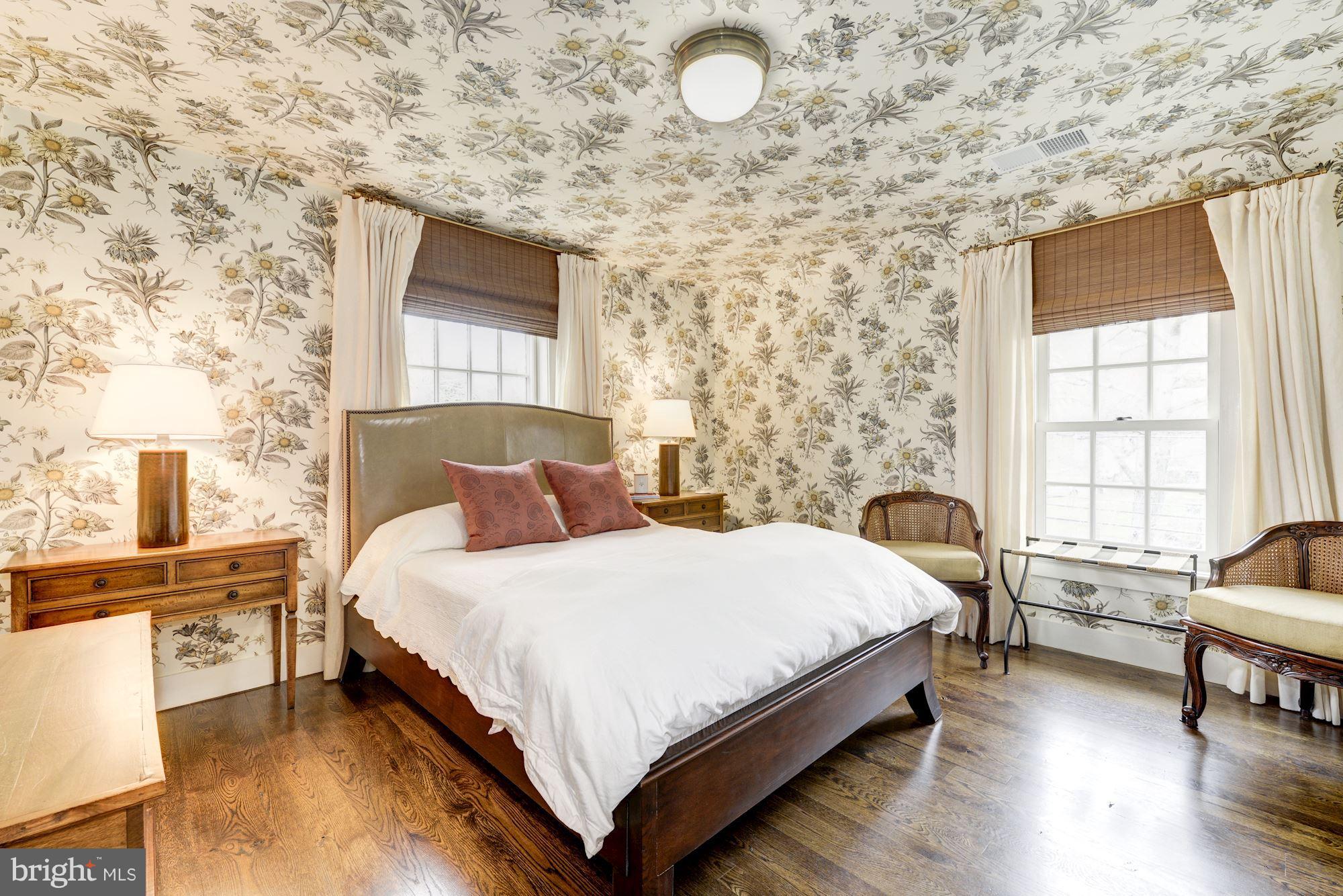 6134 Nevada Avenue Chevy Chase, MD 20815 - Photo 23 of 30 a bed room with a bed and a chair