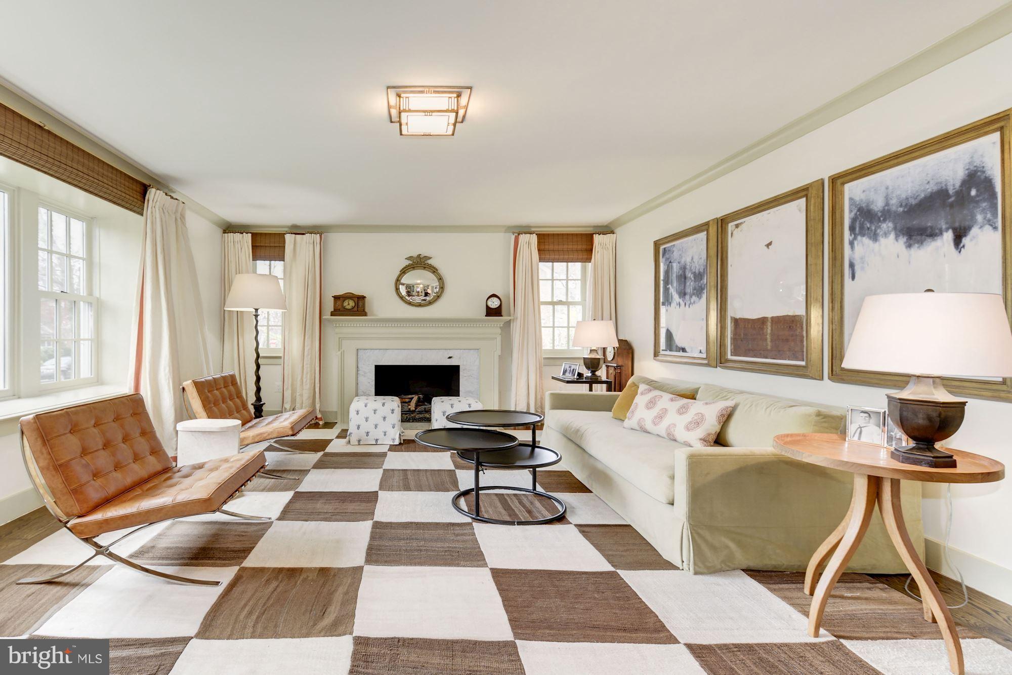 6134 Nevada Avenue Chevy Chase, MD 20815 - Photo 4 of 30 a living room with a couch and a fireplace