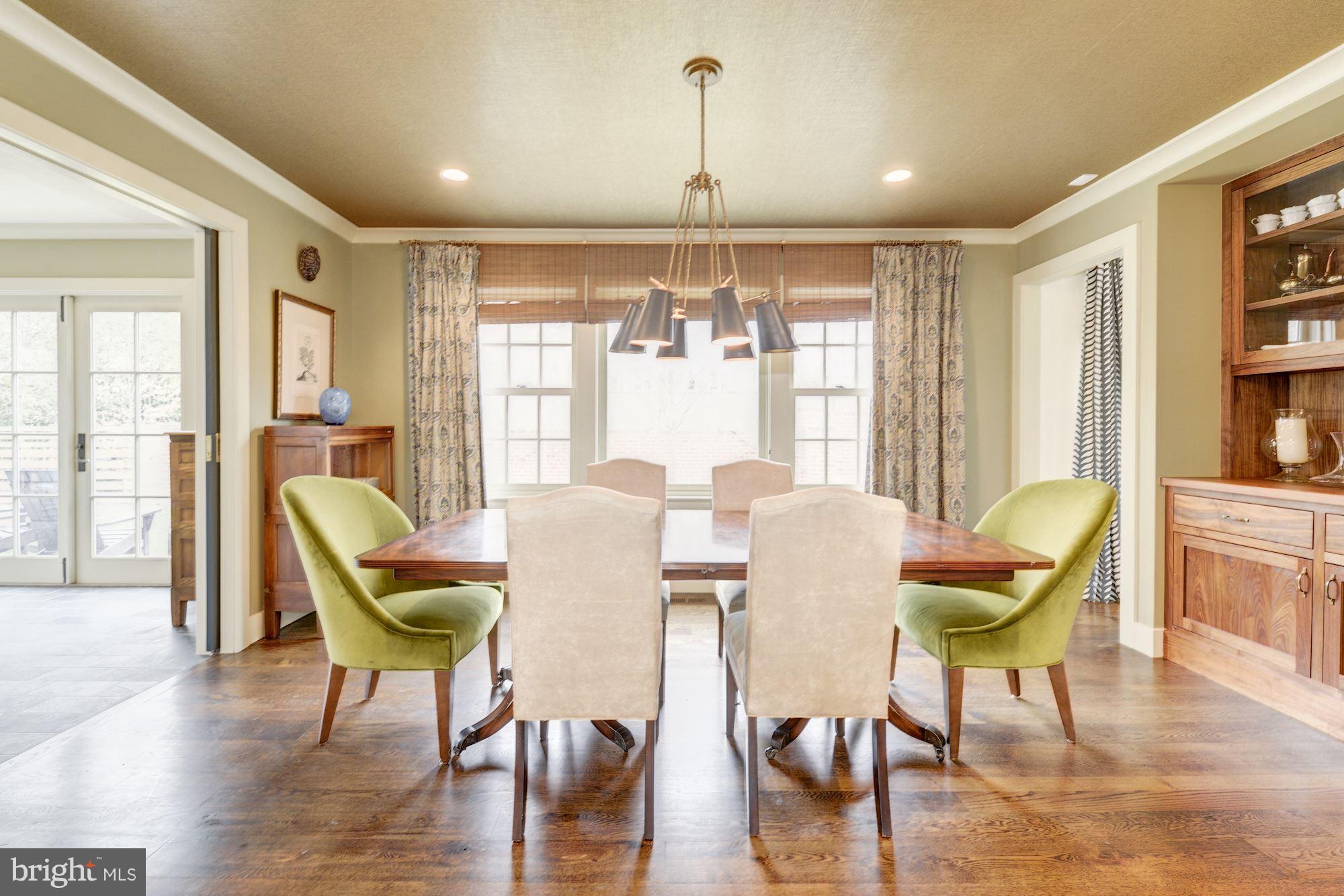 6134 Nevada Avenue Chevy Chase, MD 20815 - Photo 5 of 30 a view of a dining room with furniture window and wooden floor
