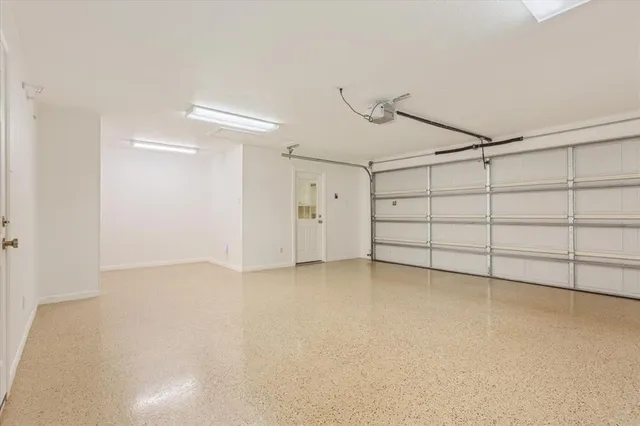 a view of a big room with wooden floor and a fireplace
