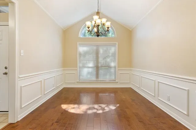 an empty room with windows and entrance