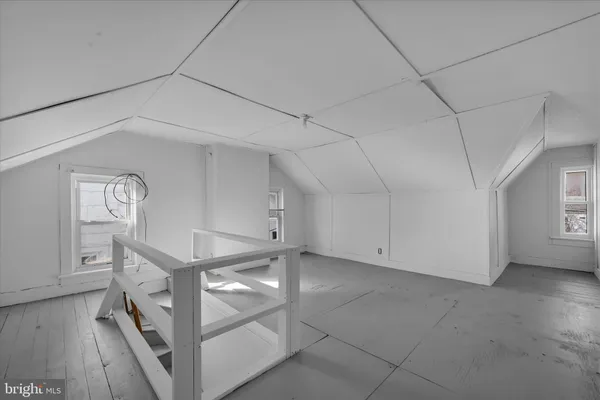 a view of an empty room and entryway