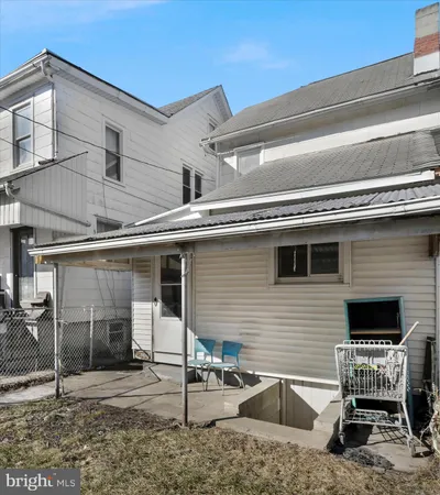 a view of a patio with table and chairs