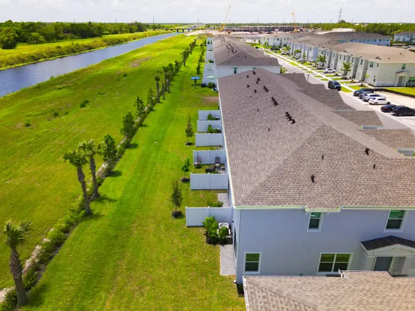 an aerial view of house with yard swimming pool and outdoor seating