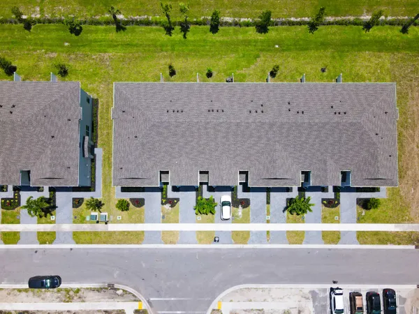 swimming pool view with a garden view