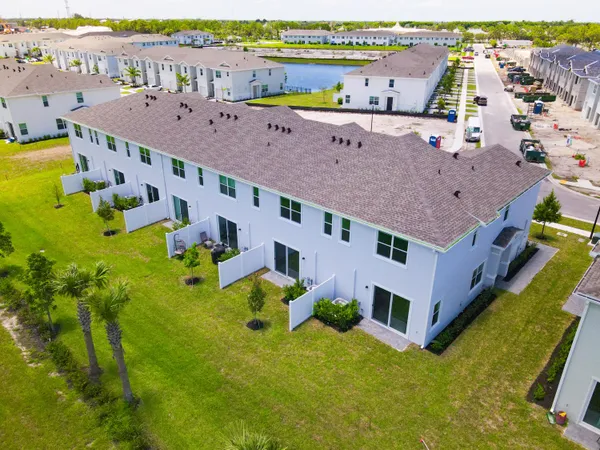 a kitchen with a refrigerator a stove a microwave a sink and cabinets