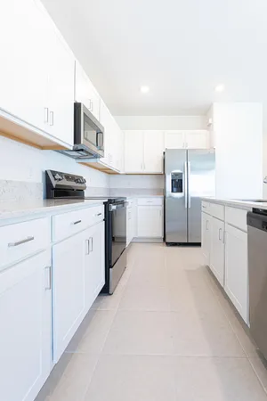 a kitchen with a sink and a large window