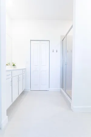 a bathroom with a double vanity sink and mirror