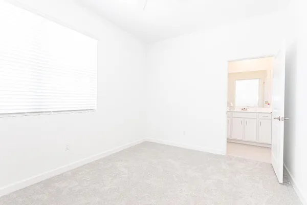 a bathroom with a bathtub a sink a toilet a mirror and vanity