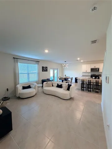 a living room with furniture and a couch