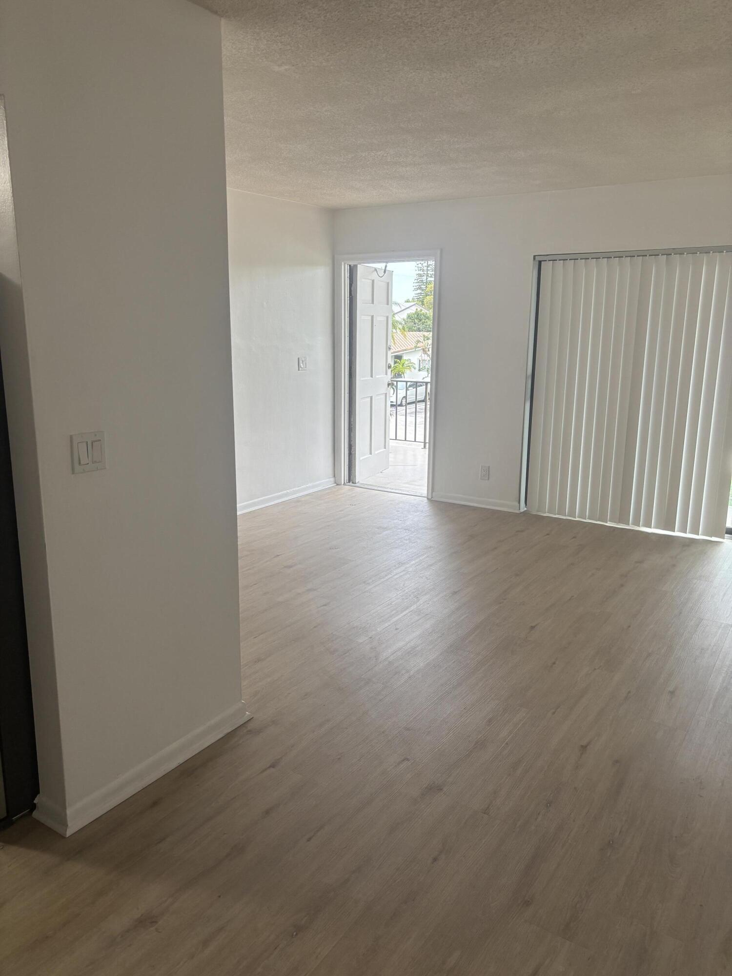 521 Northeast 45th Street Boca Raton, FL 33431 - Photo 4 of 17 an empty room with windows