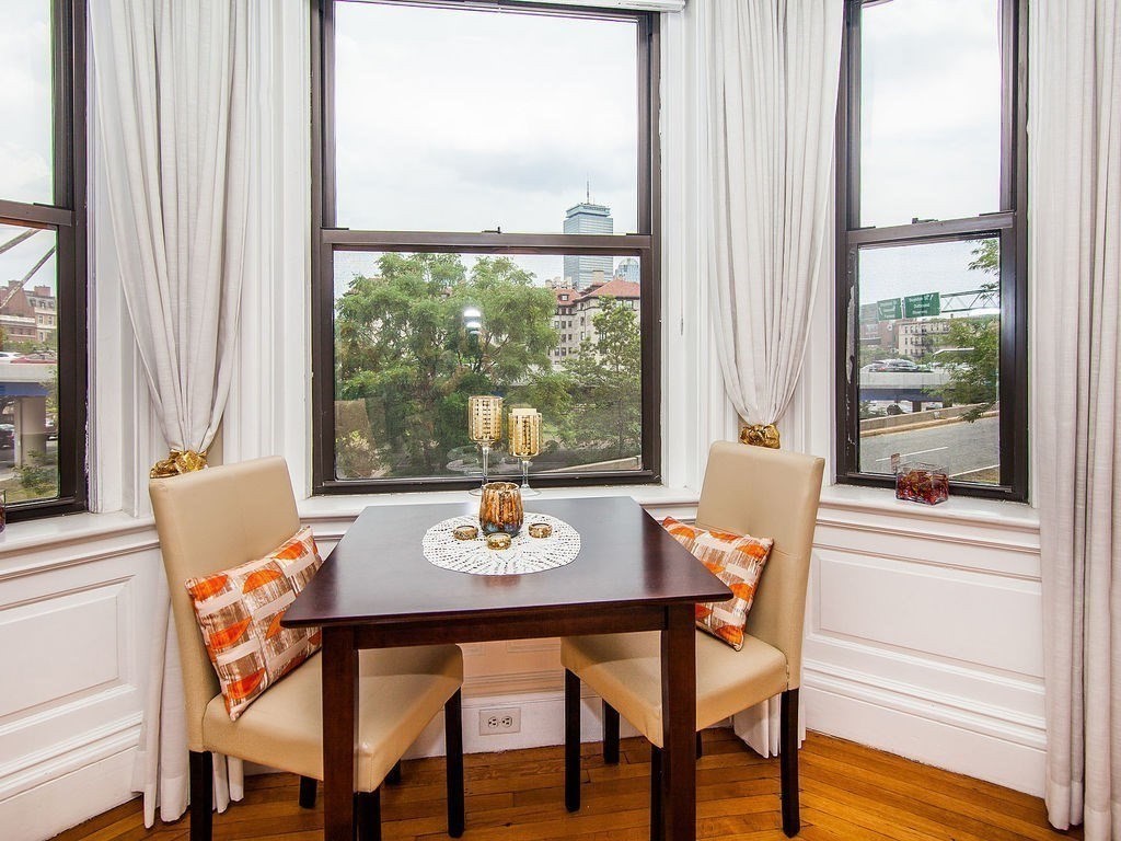 a view of a dining room with furniture window and outside view