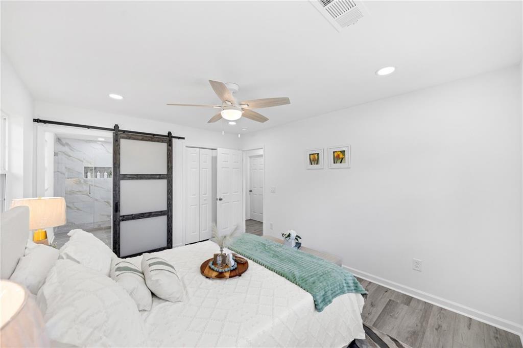 3892 Northstrand Drive Decatur, GA 30035 - Photo 12 of 25 a bedroom with a bed and a table