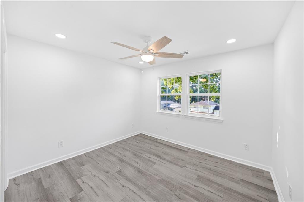 3892 Northstrand Drive Decatur, GA 30035 - Photo 19 of 25 wooden floor in an empty room with a window