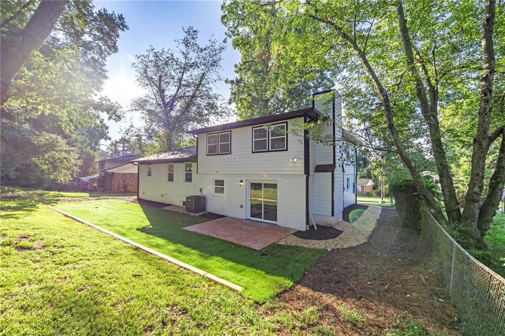 3892 Northstrand Drive Decatur, GA 30035 - Photo 23 of 25 a view of a house with backyard and a tree