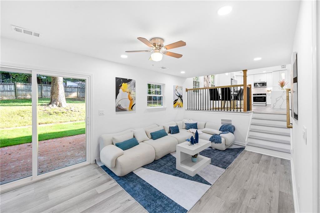 3892 Northstrand Drive Decatur, GA 30035 - Photo 8 of 25 a living room with furniture and wooden floor
