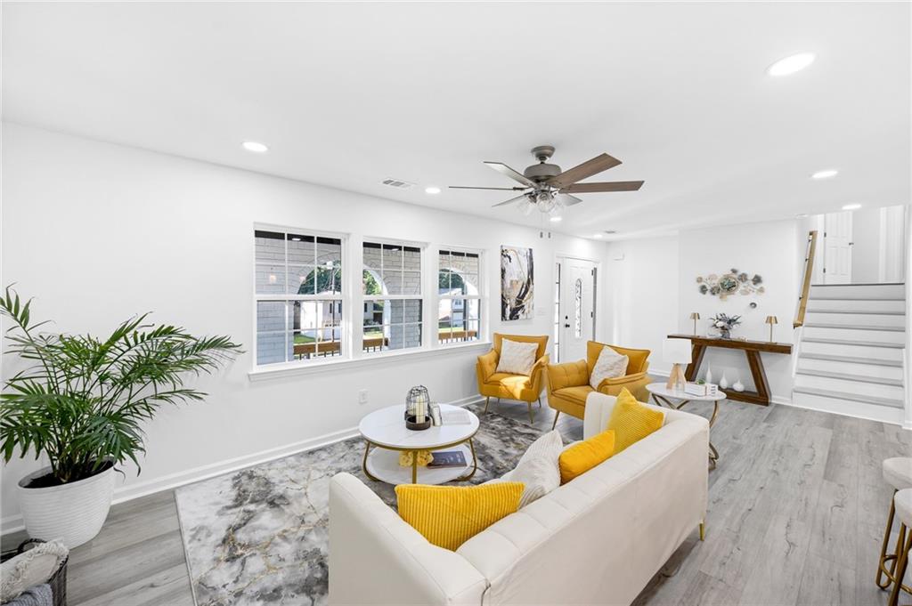 3892 Northstrand Drive Decatur, GA 30035 - Photo 9 of 25 a living room with furniture kitchen view and a potted plant