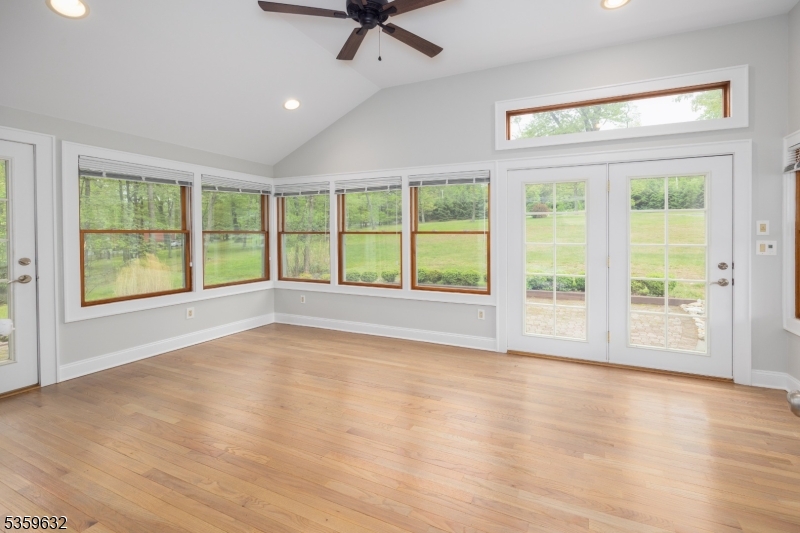 1625 Highway 206 Chester, NJ 07930 - Photo 13 of 46 a view of an empty room with a window and wooden floor