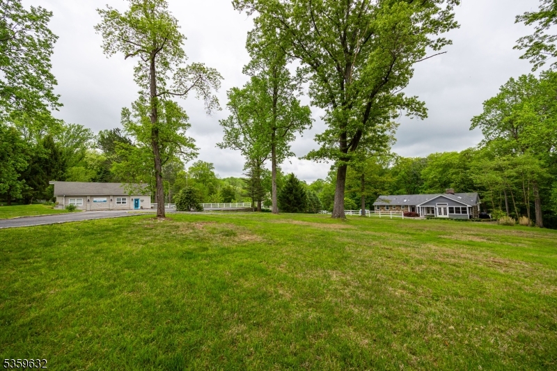 1625 Highway 206 Chester, NJ 07930 - Photo 2 of 46 a backyard of a house with table and chairs