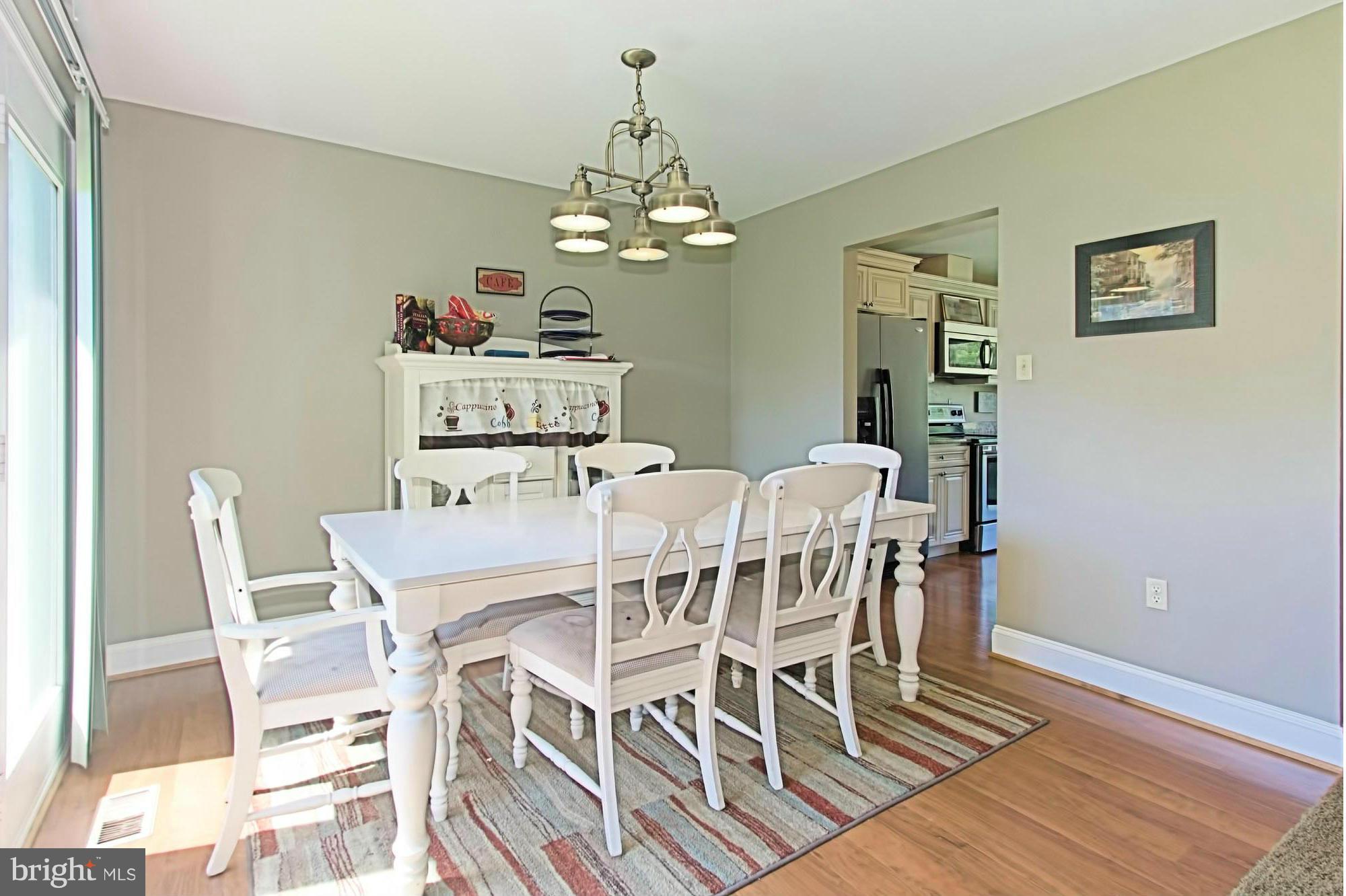 2329 Rosedown Drive Reston, VA 20191 - Photo 6 of 30 Sunny Dining Room with Designer Light Fixture