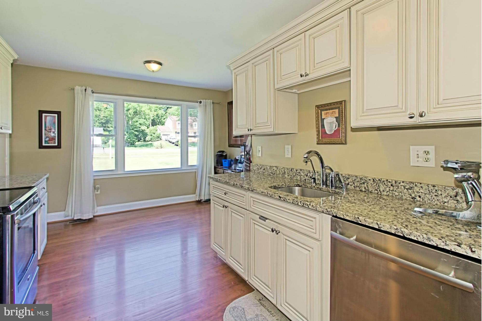2329 Rosedown Drive Reston, VA 20191 - Photo 7 of 30 Open Kitchen w/ New Cabinets & Granite Counters