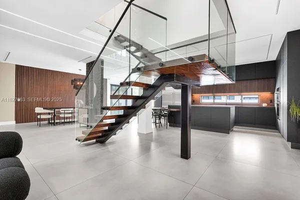 a kitchen with stainless steel appliances granite countertop a sink and a stove