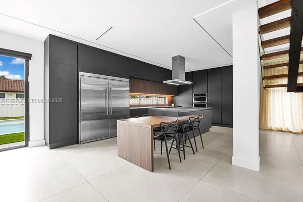 a kitchen with a sink and refrigerator