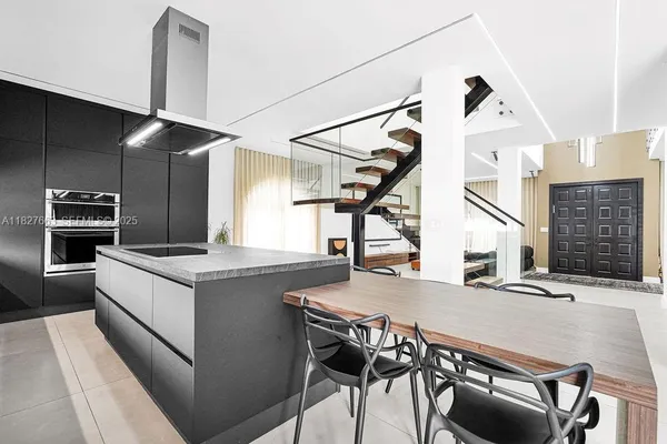 a bathroom with a sink mirror and vanity