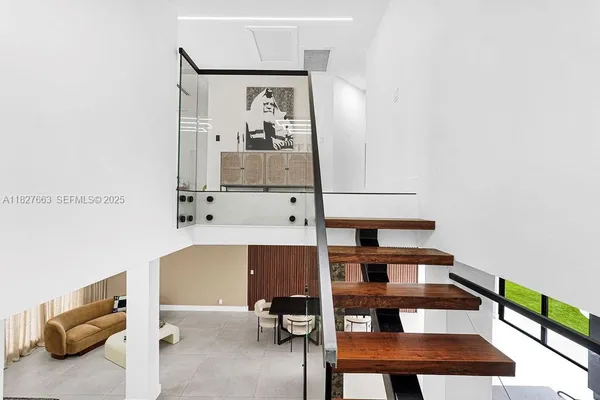 a bedroom with bed and flat screen tv