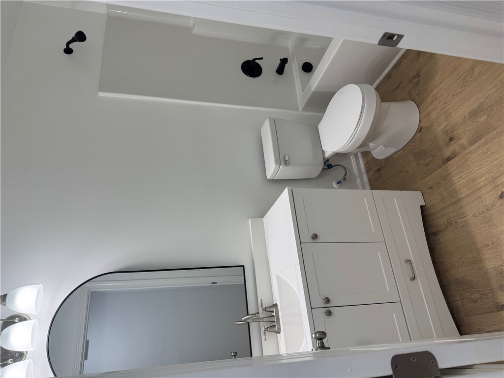 701 Delia Street, Unit B Anderson, SC 29624 - Photo 16 of 25 This clean and bright bathroom features modern fixtures and practical flooring.