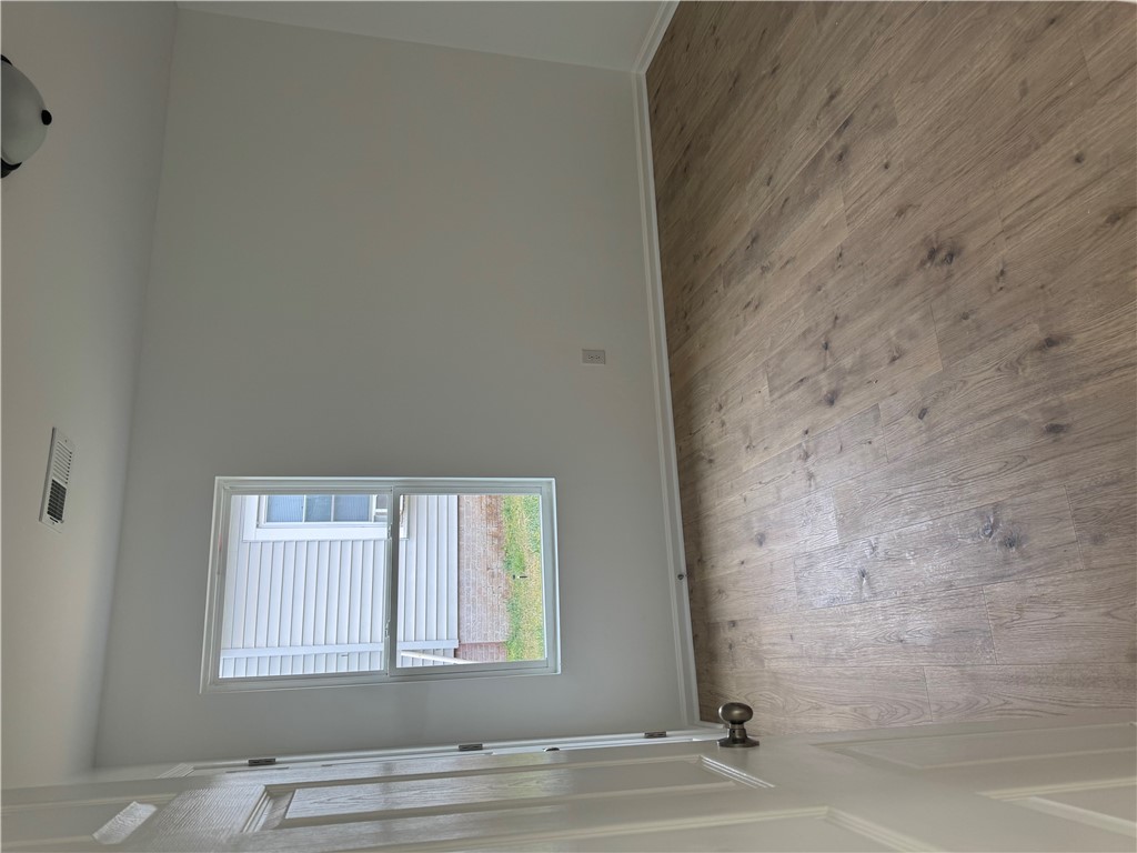 701 Delia Street, Unit B Anderson, SC 29624 - Photo 17 of 25 This living space features durable wood flooring and ample natural light through a single window.