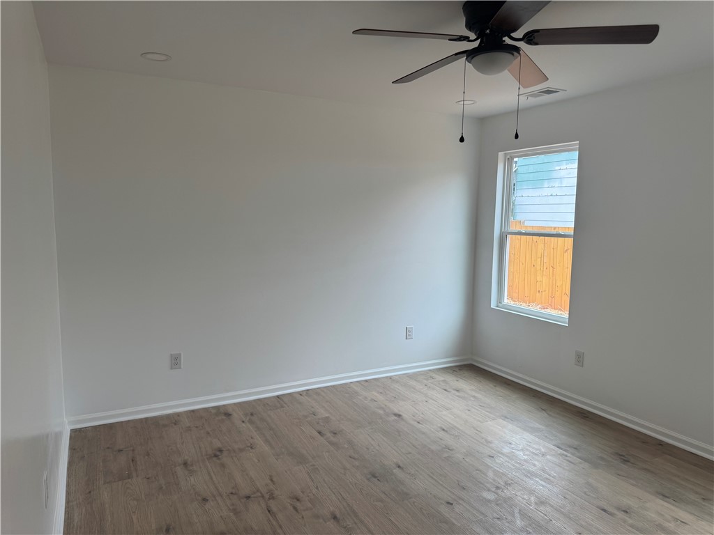 701 Delia Street, Unit B Anderson, SC 29624 - Photo 20 of 25 This bright room features a clean design, offering comfortable living with natural light and durable flooring.