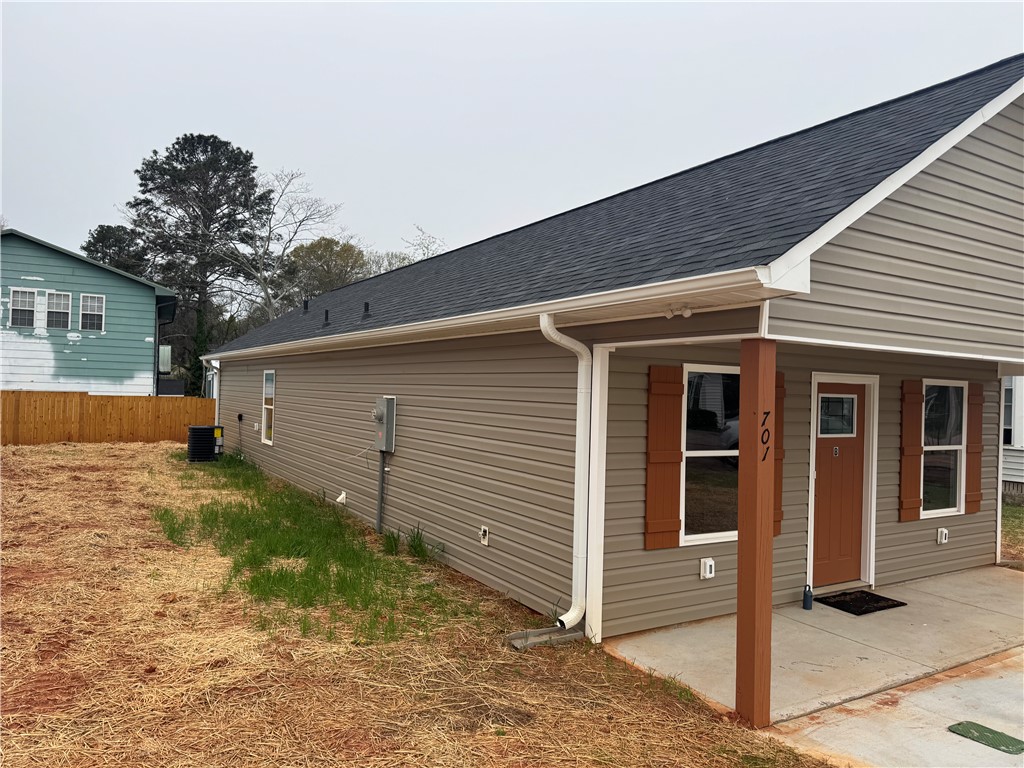 701 Delia Street, Unit B Anderson, SC 29624 - Photo 3 of 25 This newly constructed residence features modern siding and a welcoming covered porch entry.
