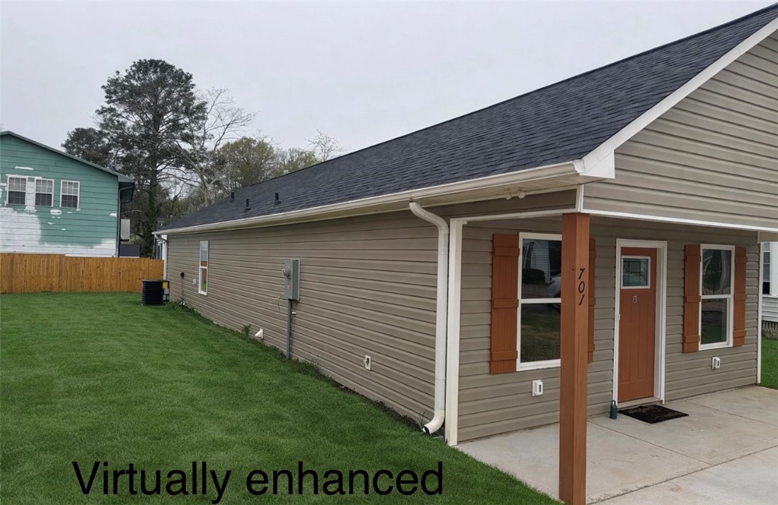 701 Delia Street, Unit B Anderson, SC 29624 - Photo 4 of 25 This newly constructed home features a well-maintained exterior and a welcoming front entrance.