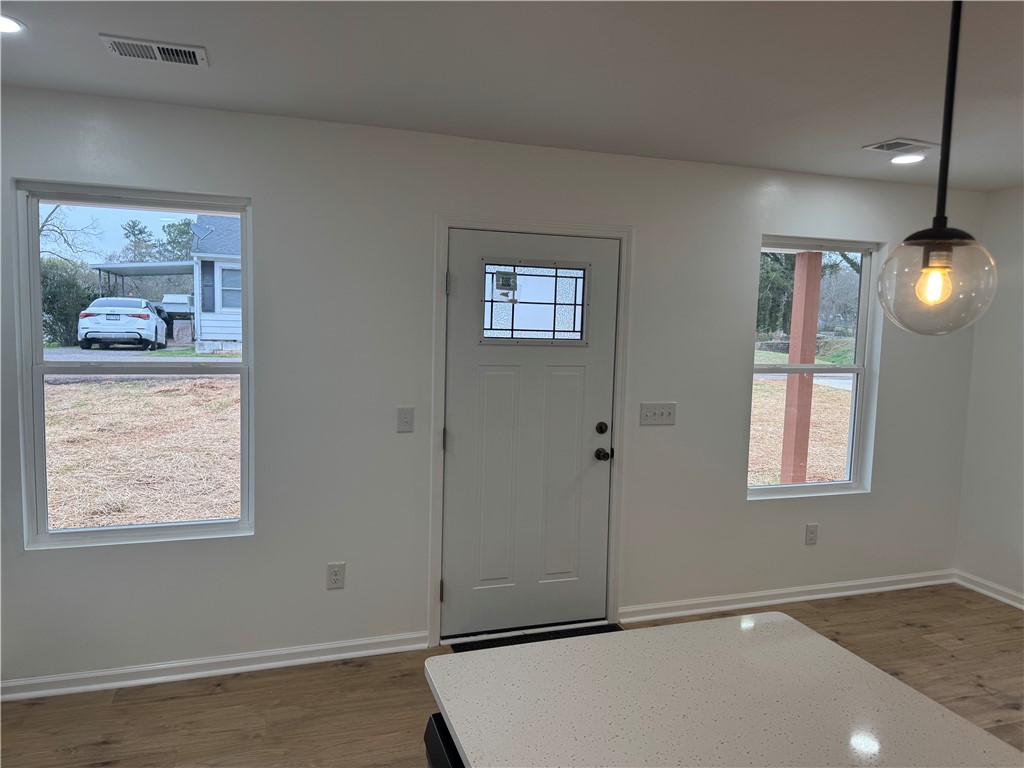 701 Delia Street, Unit B Anderson, SC 29624 - Photo 7 of 25 This inviting entrance features ample natural light and durable flooring, perfect for welcoming guests.