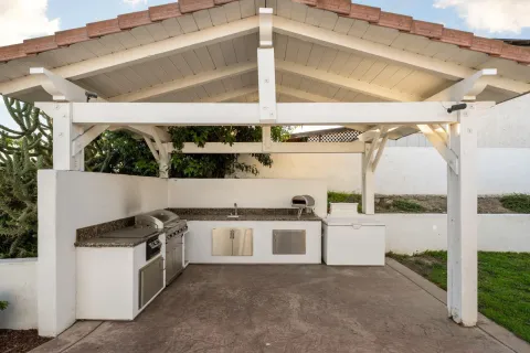 a view of a kitchen with a stove top oven