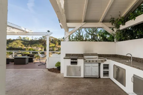 a kitchen with a stove and a white refrigerator