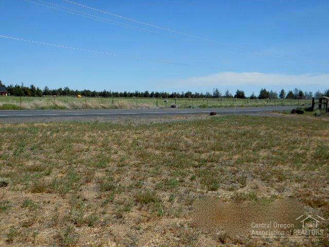 63893 Deschutes Road Bend, OR 97701 - Photo 3 of 4 a view of a lake with houses in the background