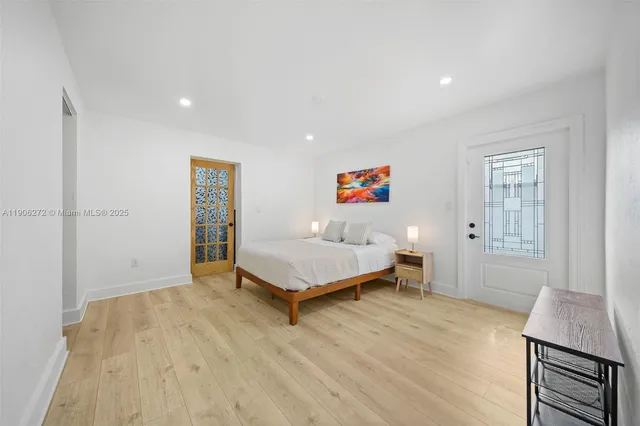 a living room with a bed furniture and a window