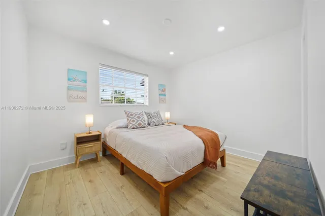 a bedroom with a bed and a chair