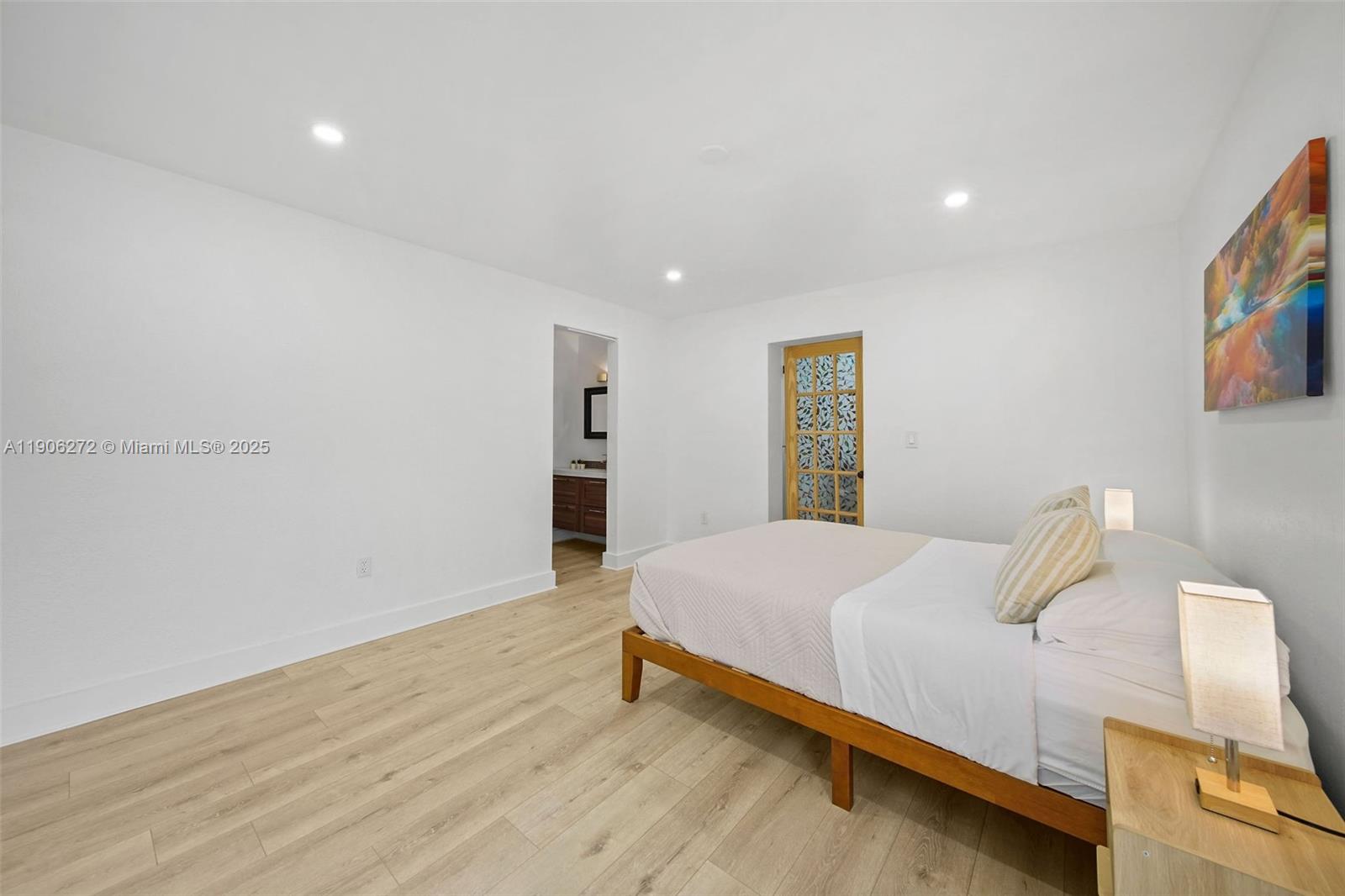 2761 Southwest 92nd Place Miami, FL 33165 - Photo 14 of 19 a bedroom with a bed and a wall painting