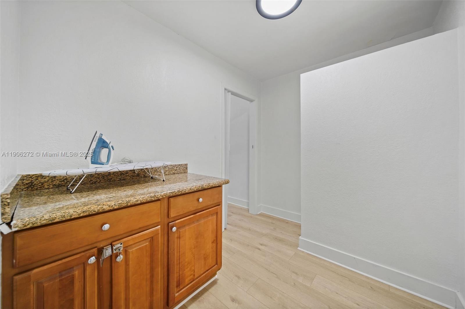 2761 Southwest 92nd Place Miami, FL 33165 - Photo 15 of 19 a bathroom with a granite countertop sink and vanity