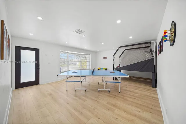 a living room with furniture window and wooden floor