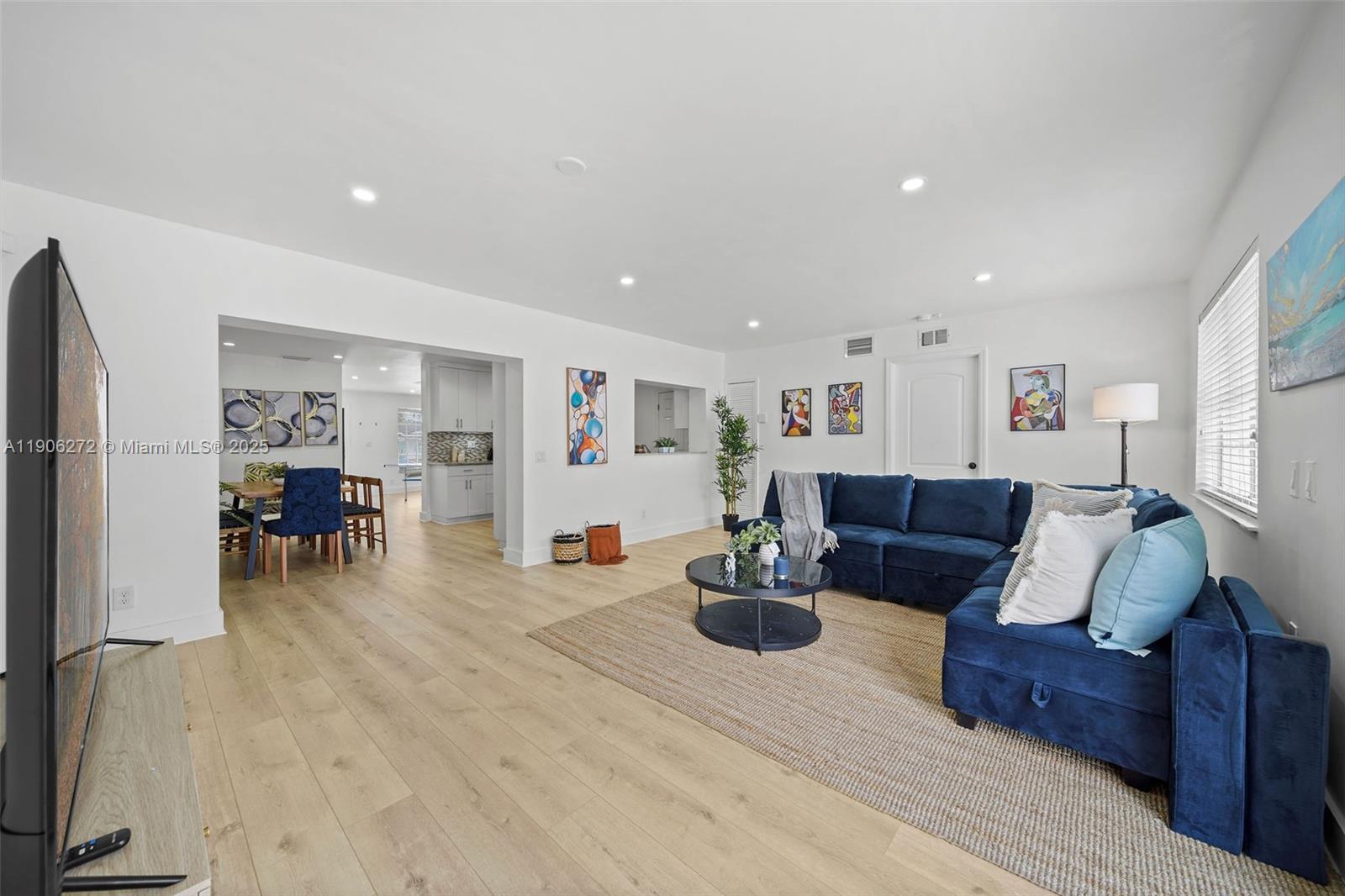 2761 Southwest 92nd Place Miami, FL 33165 - Photo 5 of 19 a living room with furniture and wooden floor