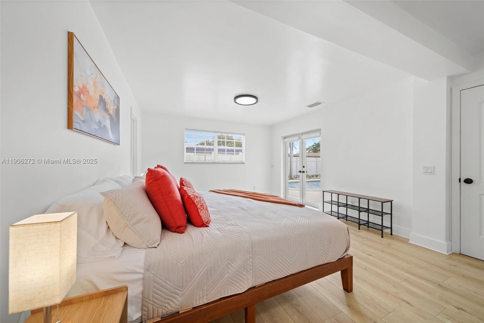 2761 Southwest 92nd Place Miami, FL 33165 - Photo 8 of 19 a bedroom with a bed and a wooden floor