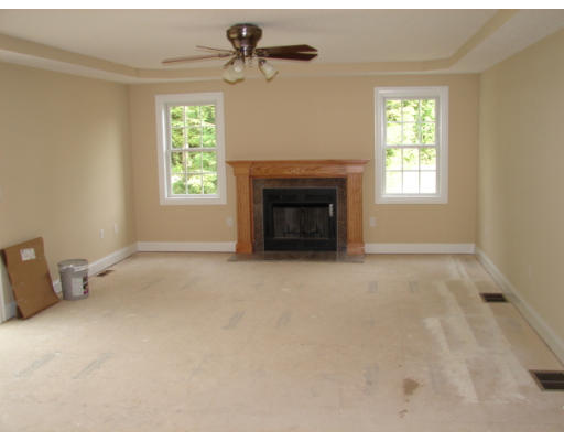 479 Montgomery Road Westfield, MA 01085 - Photo 3 of 11 a view of empty room with a fireplace